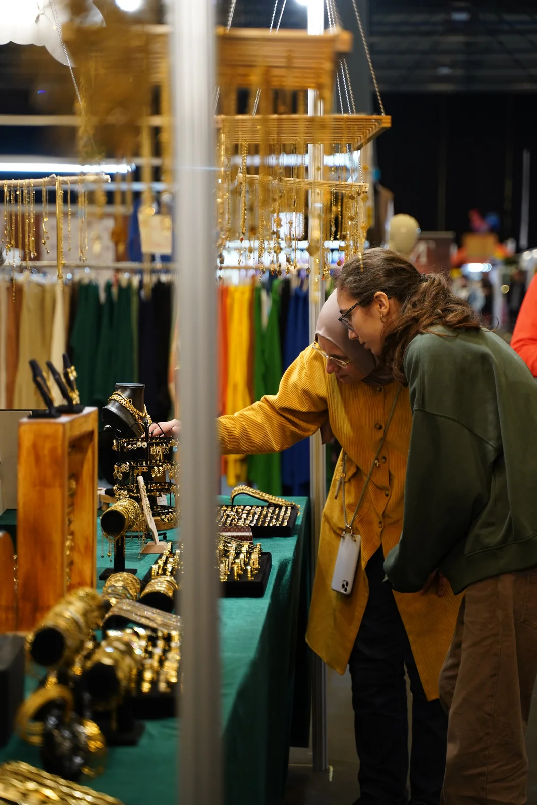 Visitors discovering jewellery at an exhibitor stand